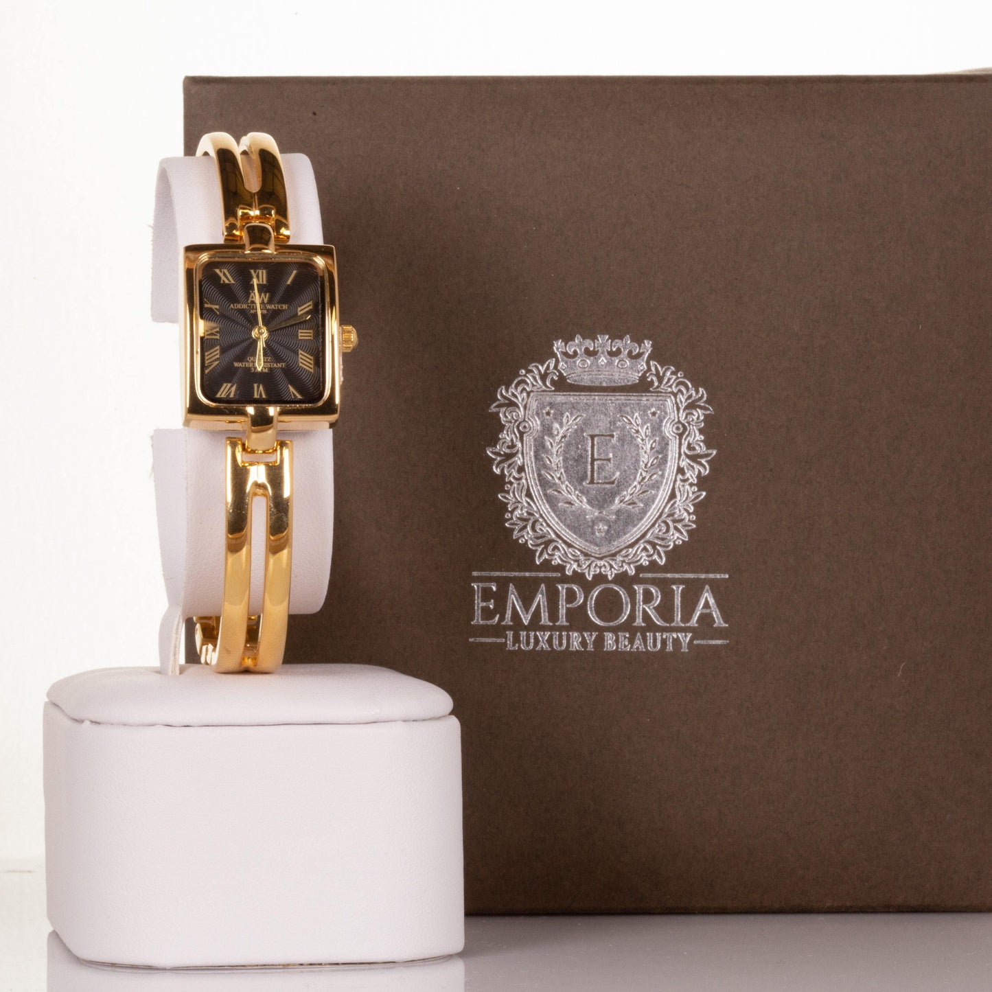 AW arany színű női óra fekete és római számos számlappal - Ékszer Akció